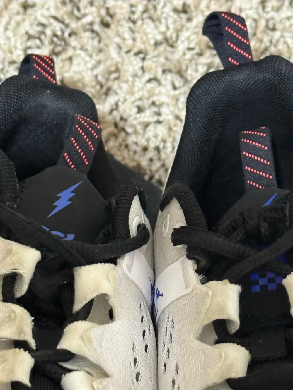 Jordan Men's White Athletic Shoes with Black and Blue Accents